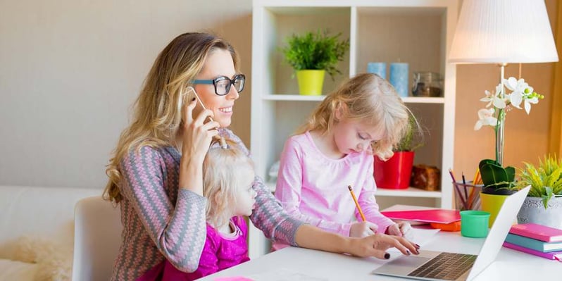 Woman working from home with children